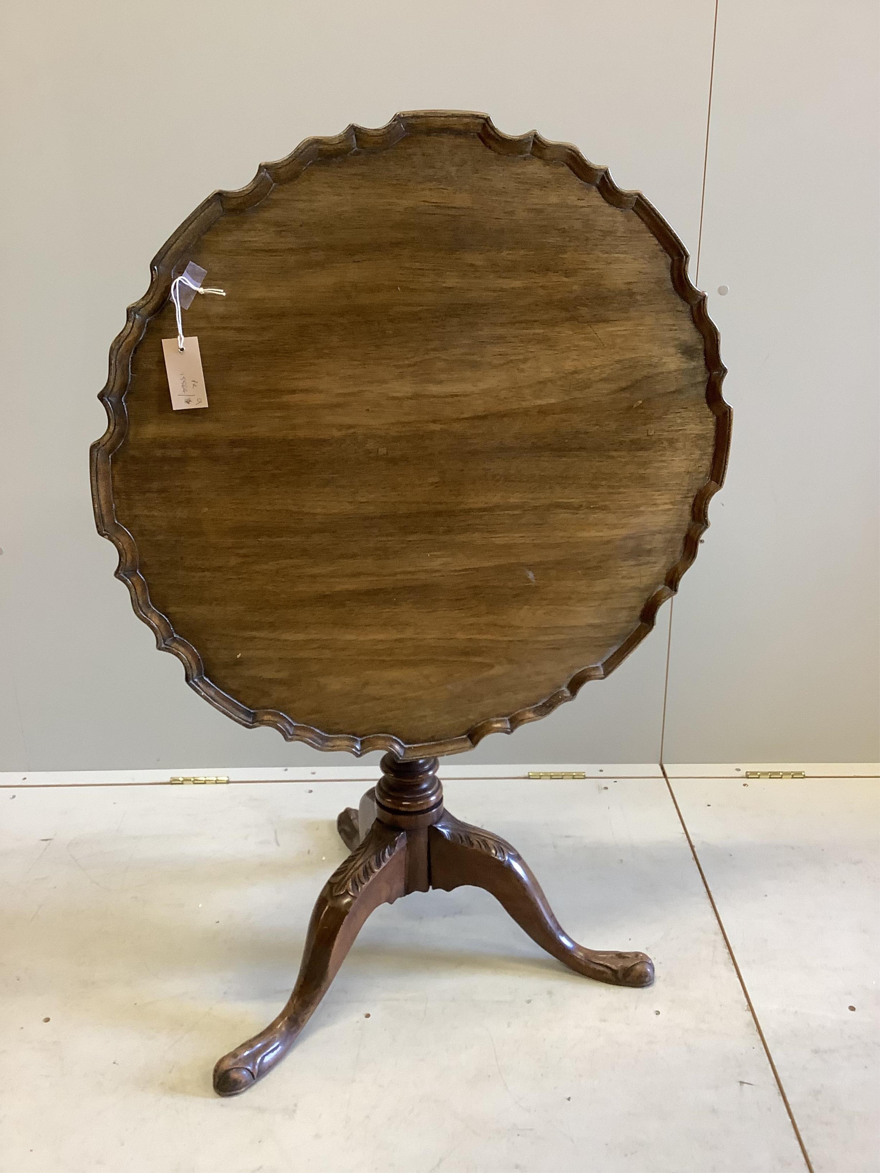 A Georgian style mahogany pie crust tripod table, width 75cm, height 72cm. Condition - fair, top a little faded